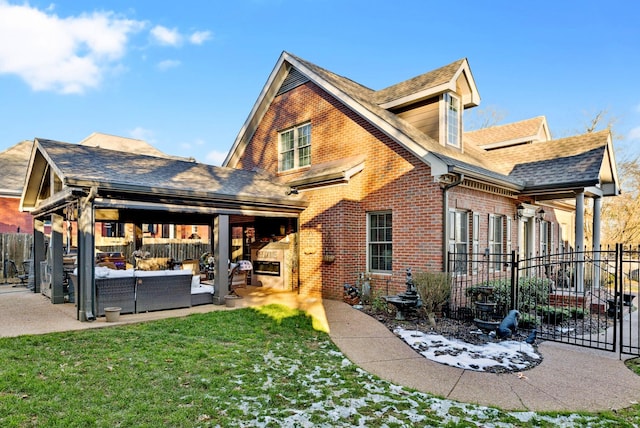 rear view of house with an outdoor hangout area, a yard, and a patio