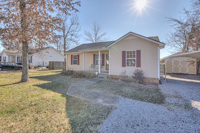 view of front of property with a front lawn, a porch, and a carport