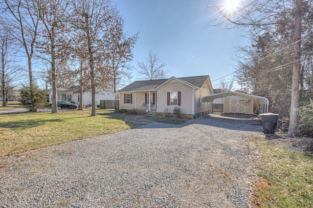 view of front facade with a front yard and a carport