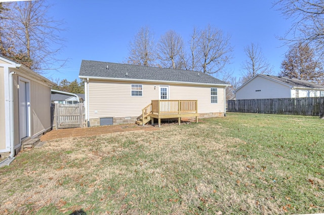 back of property featuring a deck and a yard