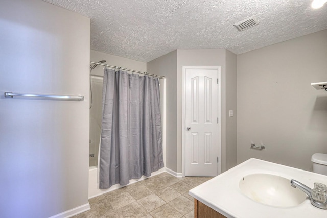 full bathroom featuring a textured ceiling, toilet, vanity, and shower / bathtub combination with curtain