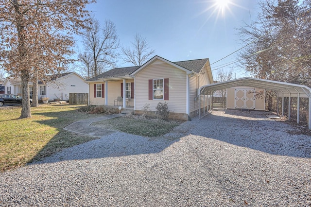 view of front of home featuring a front lawn and a carport