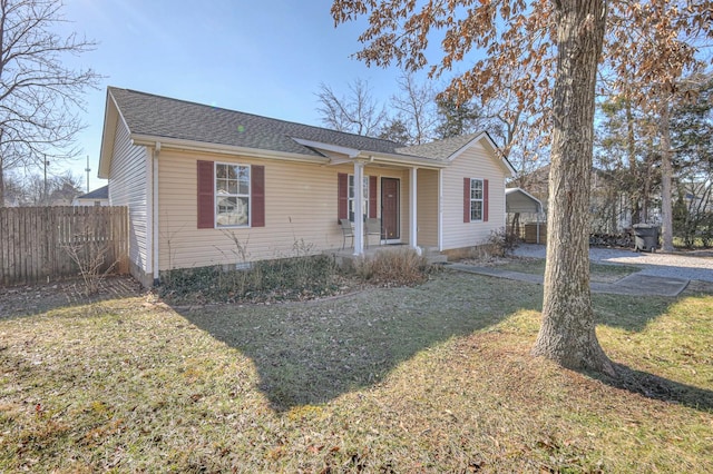 view of front of house featuring a front lawn and a carport