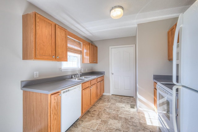 kitchen featuring sink and white appliances