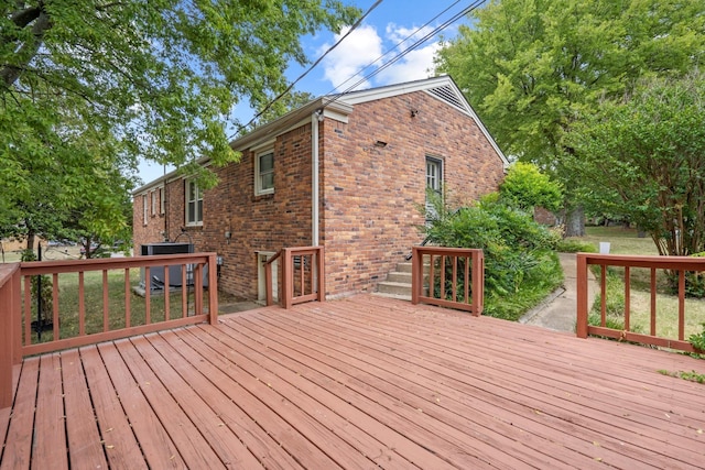 wooden deck featuring central AC unit