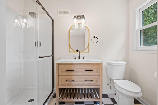 bathroom featuring toilet, walk in shower, and vanity