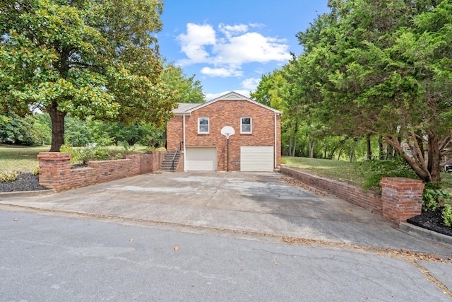 view of side of home featuring a garage