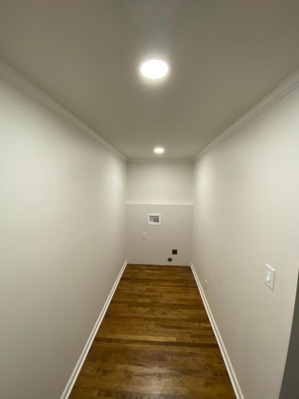 laundry room featuring dark hardwood / wood-style flooring, crown molding, and hookup for a washing machine