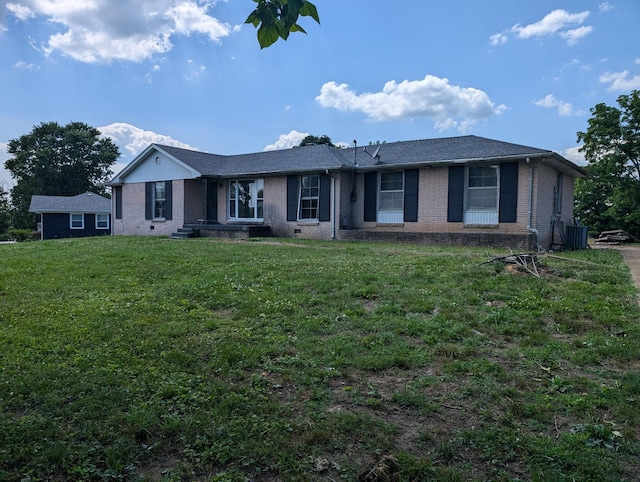 ranch-style home with a front lawn and central AC unit