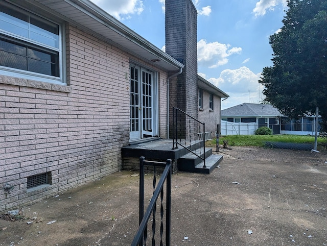 view of property exterior with a patio