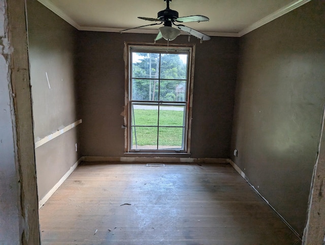 spare room featuring ceiling fan, crown molding, and light hardwood / wood-style flooring