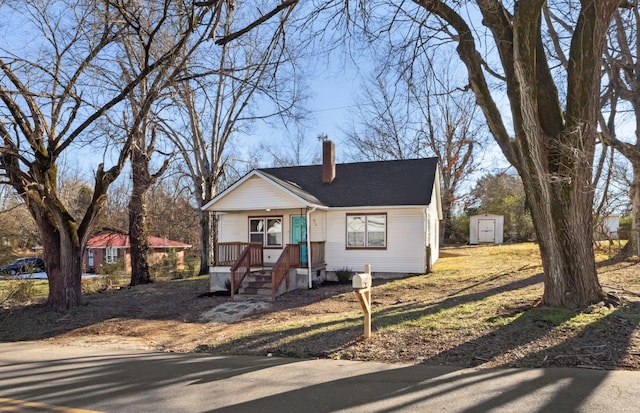 view of front of house featuring a storage shed