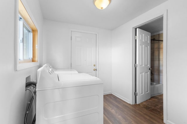 washroom featuring dark hardwood / wood-style flooring and independent washer and dryer