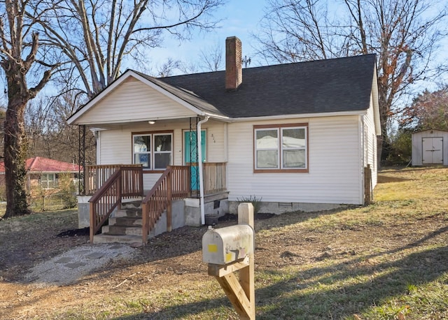 view of front of house featuring a shed