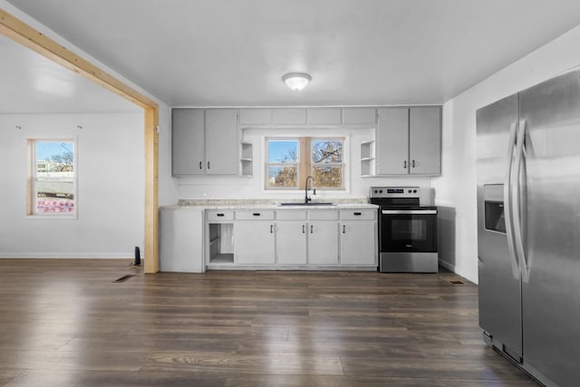 kitchen featuring gray cabinets, sink, appliances with stainless steel finishes, and dark hardwood / wood-style floors