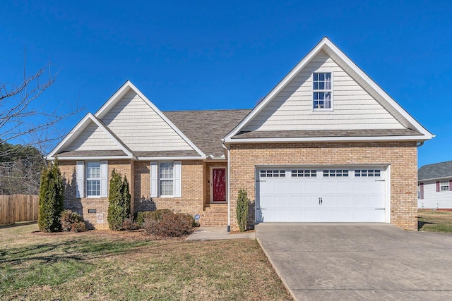 view of front of home featuring a front yard and a garage