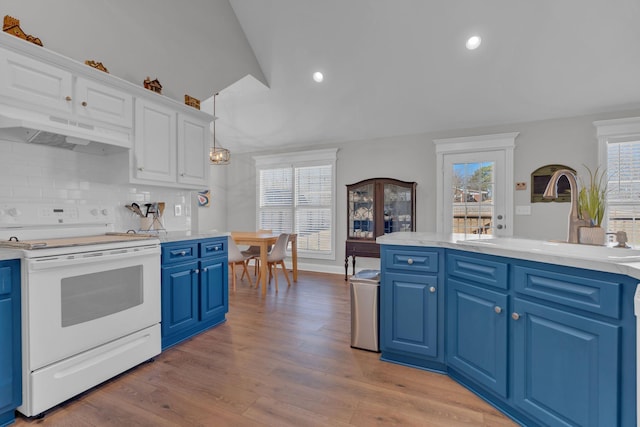 kitchen featuring pendant lighting, electric stove, backsplash, blue cabinetry, and sink