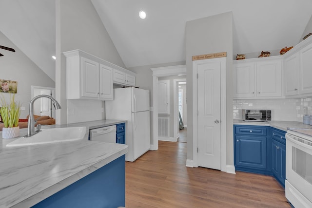 kitchen featuring white cabinetry, white appliances, and blue cabinets