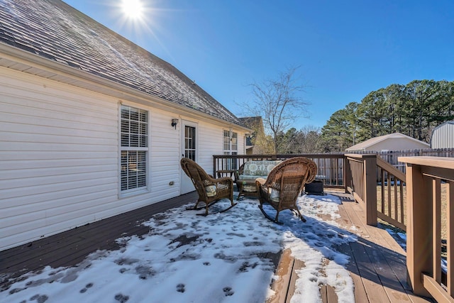 view of snow covered deck