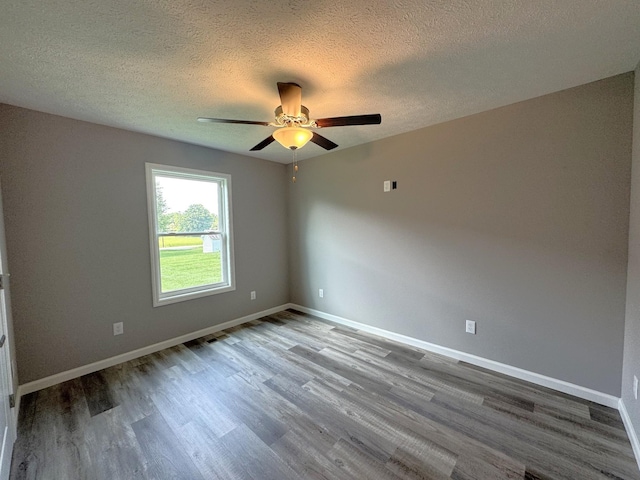 unfurnished room with ceiling fan, a textured ceiling, and hardwood / wood-style flooring