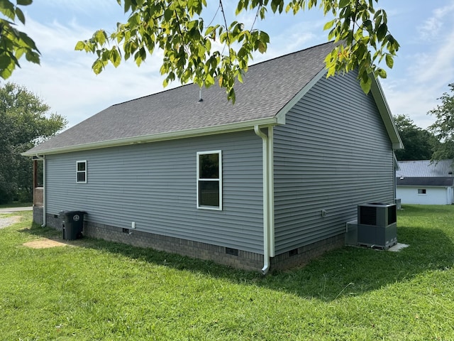 view of home's exterior featuring a yard and central air condition unit