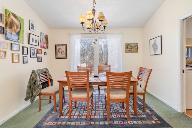 dining room featuring an inviting chandelier, carpet, baseboards, and a textured ceiling