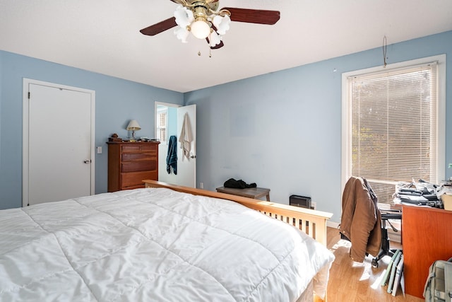 bedroom featuring light wood-type flooring and ceiling fan