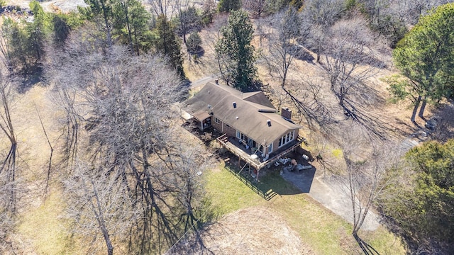 birds eye view of property with a forest view