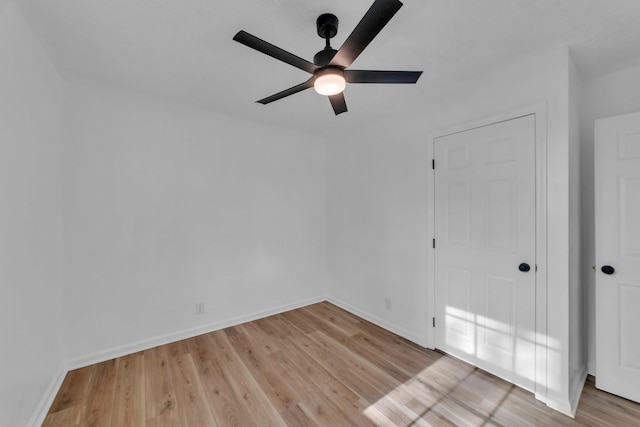 empty room featuring light hardwood / wood-style floors and ceiling fan