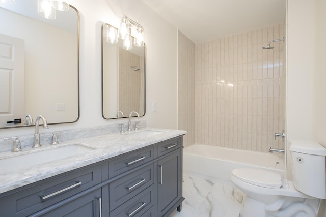 full bathroom with toilet, tiled shower / bath combo, and vanity