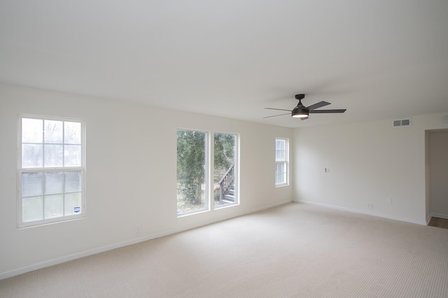 unfurnished room with light carpet and ceiling fan