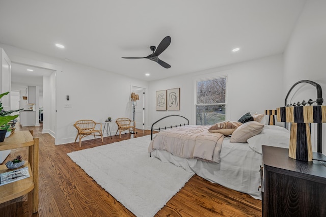 bedroom featuring recessed lighting, ceiling fan, baseboards, and wood finished floors