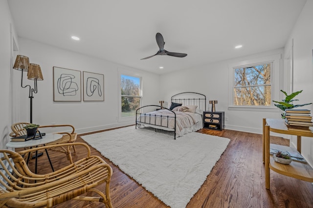 bedroom featuring dark wood-style floors, recessed lighting, and baseboards