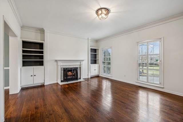 unfurnished living room with a fireplace, ornamental molding, and dark hardwood / wood-style floors