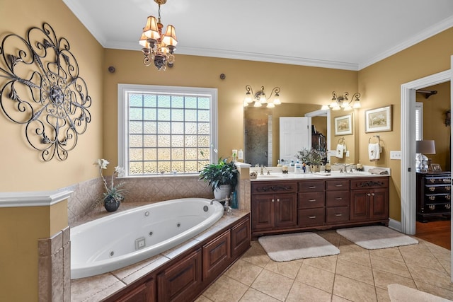 bathroom featuring tile patterned floors, vanity, an inviting chandelier, a bathtub, and ornamental molding