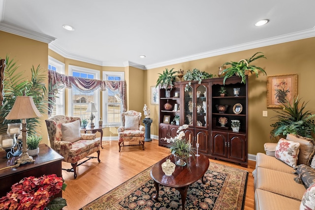 living room featuring light hardwood / wood-style flooring and crown molding