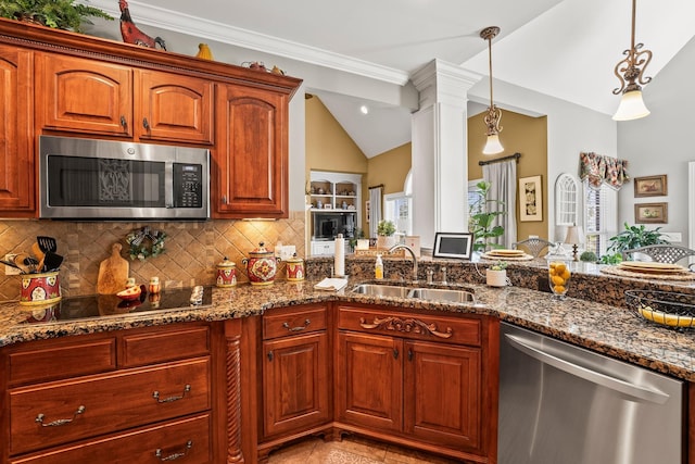 kitchen with stainless steel appliances, backsplash, decorative light fixtures, and sink