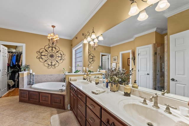 bathroom featuring an inviting chandelier, vanity, ornamental molding, and tile patterned flooring