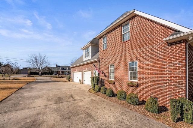 view of side of property with a garage