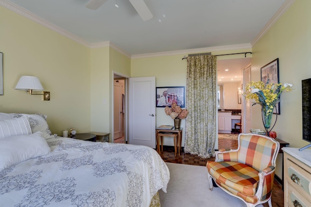 bedroom featuring ceiling fan, ensuite bath, and ornamental molding