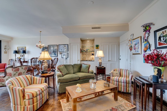 living room featuring crown molding, dark parquet flooring, and a notable chandelier