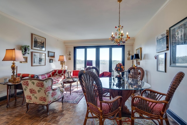 dining space featuring crown molding, parquet flooring, and a notable chandelier