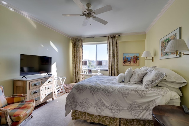 carpeted bedroom with ceiling fan and crown molding