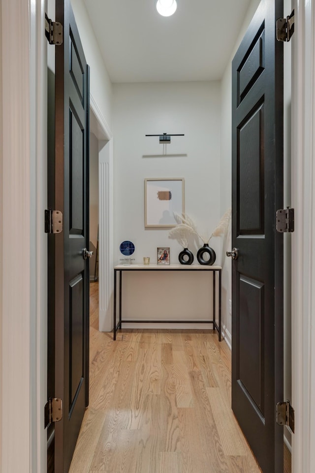 corridor featuring light hardwood / wood-style floors