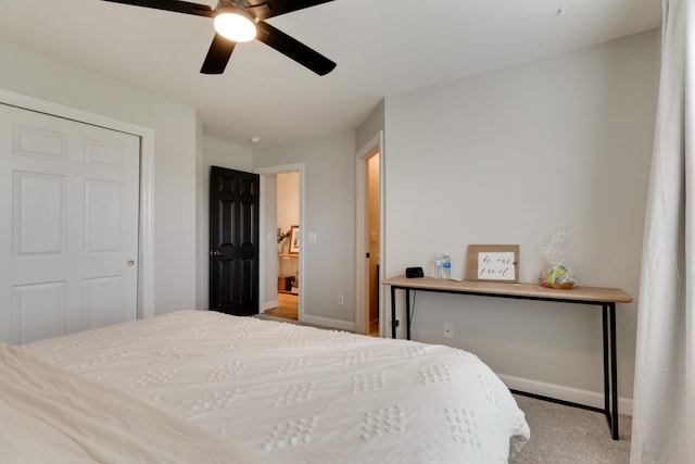 bedroom featuring ceiling fan and light colored carpet