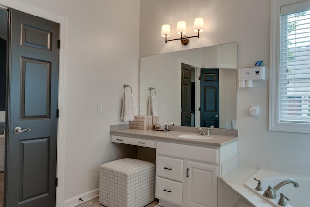 bathroom featuring a relaxing tiled tub and vanity