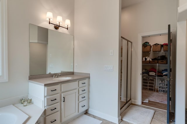 bathroom with vanity, tile patterned flooring, and independent shower and bath