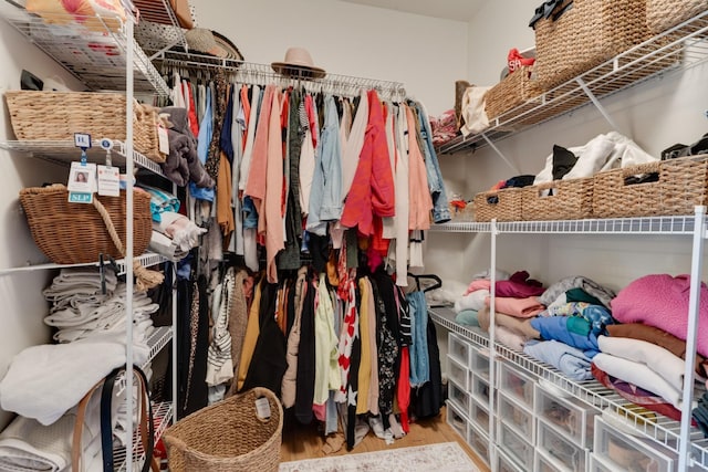 spacious closet featuring hardwood / wood-style floors