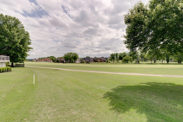 view of property's community featuring a yard