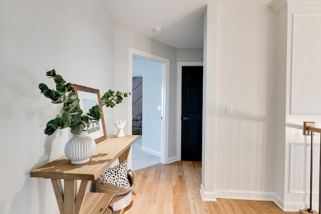 hall with light hardwood / wood-style floors